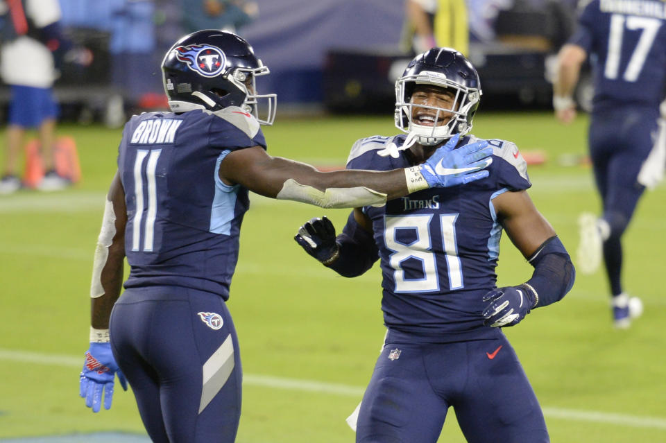 Tennessee Titans tight end Jonnu Smith (81) is congratulated by wide receiver A.J. Brown (11) after Smith caught a touchdown pass against the Buffalo Bills in the second half of an NFL football game Tuesday, Oct. 13, 2020, in Nashville, Tenn. (AP Photo/Mark Zaleski)