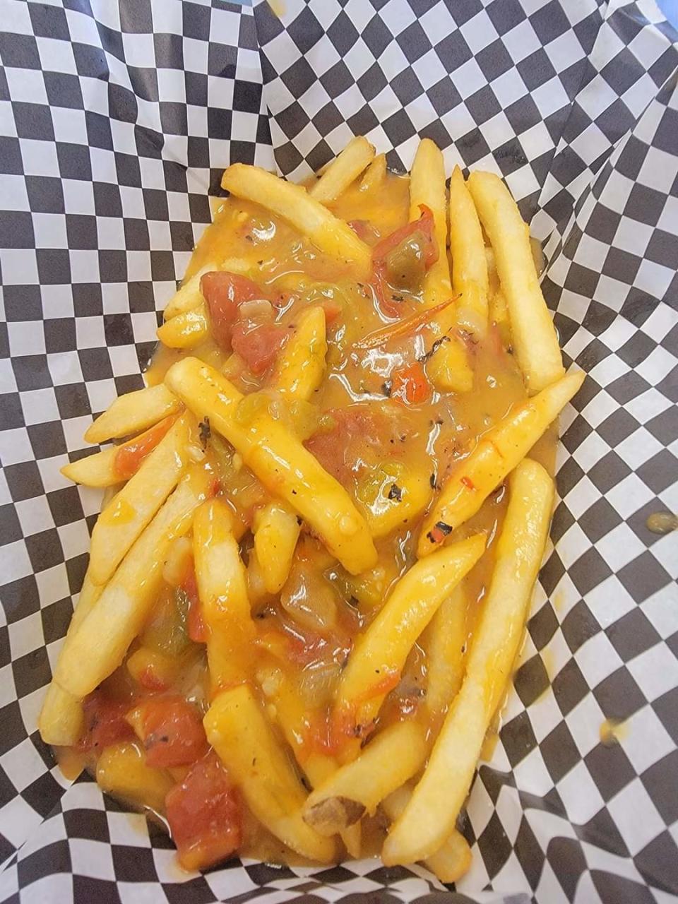 Pueblo green chile smothered french fries will be among vegan fare offered by the Cutting Board Friday through Sunday during the Chile & Frijoles Festival.