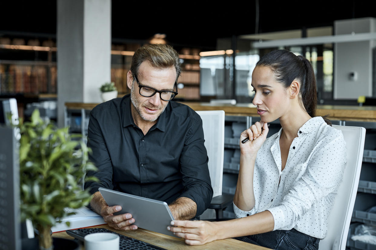 Stock picture of a man and woman at work. (Getty Images)