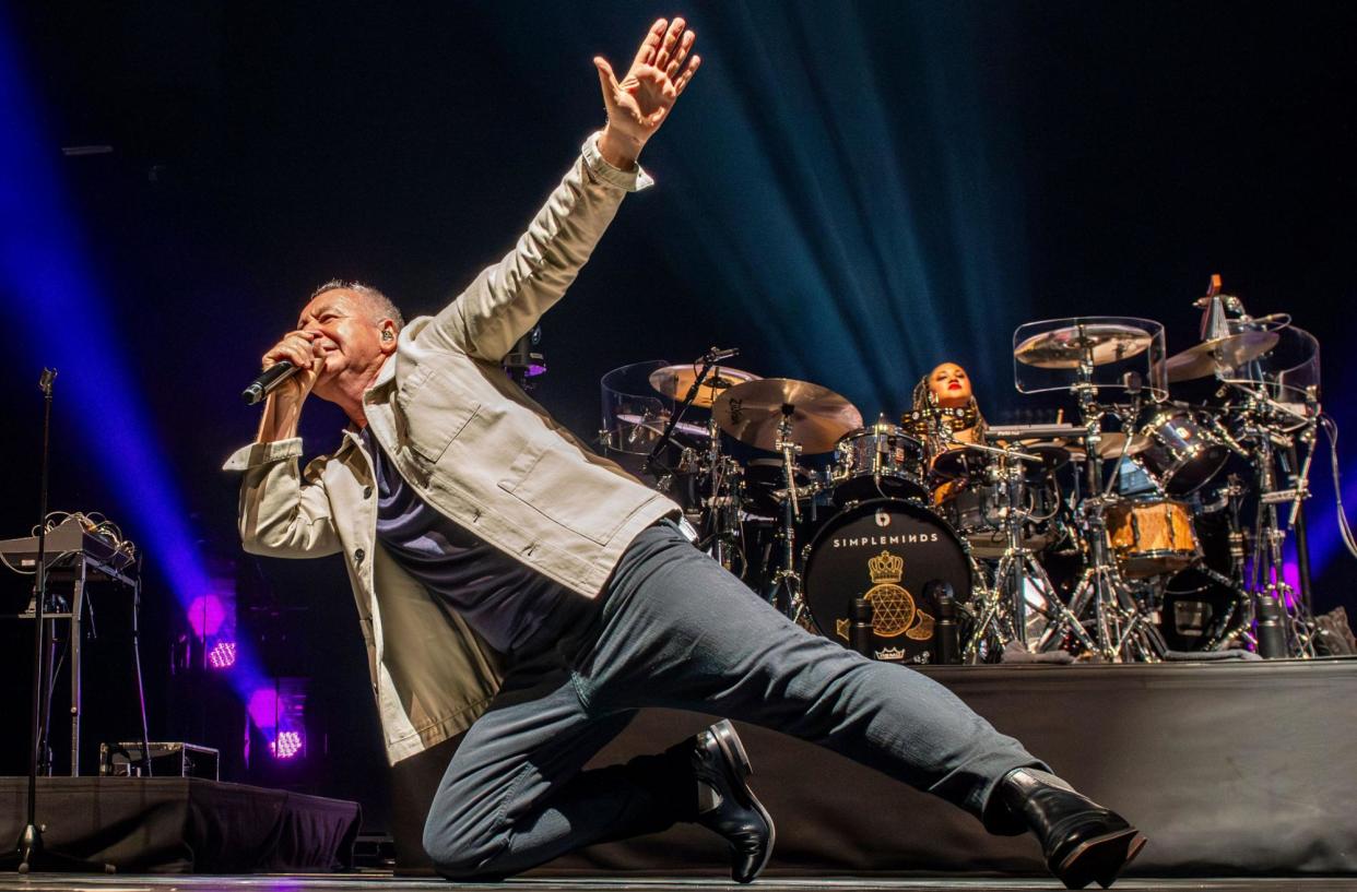 <span>Throwing shapes …Jim Kerr, of Simple Minds, in full flow at Leeds.</span><span>Photograph: Ernesto Rogata/Alamy Live News</span>