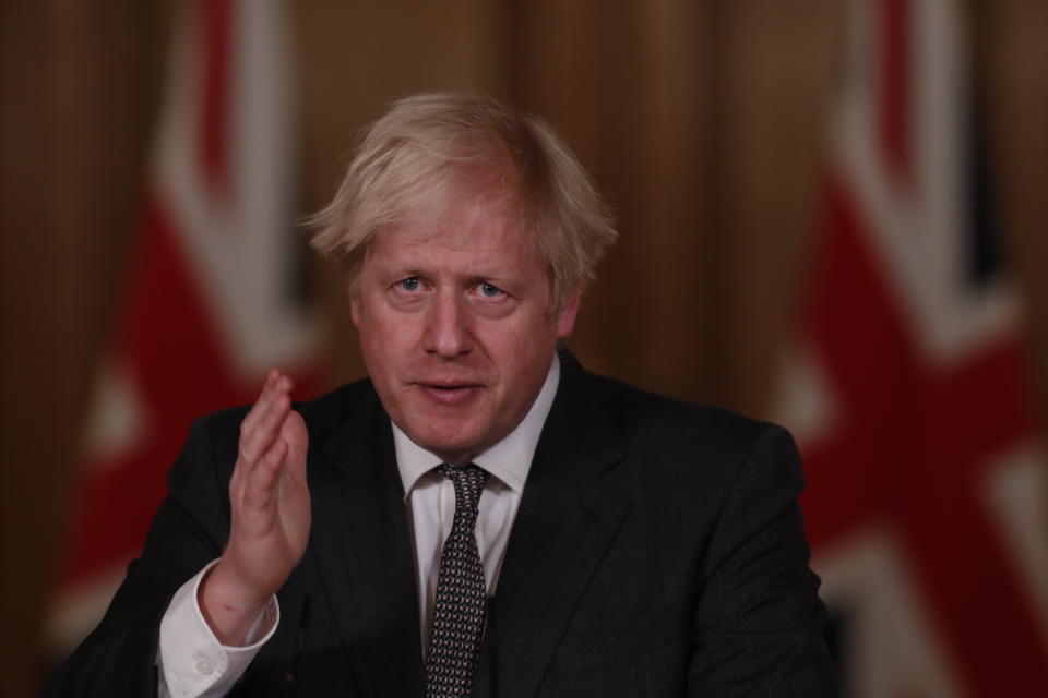 LONDON, ENGLAND - DECEMBER 30: UK Prime Minister Boris Johnson talks at a virtual press conference announcing reviewed Coronavirus tier restrictions, at 10 Downing Street on December 30, 2020 in London, England. The UK government announces that more areas of England will move into the strictest tier for Coronavirus restrictions from midnight tonight. Areas moving to Tier 3 include  Liverpool, the South West and North Yorkshire. Over half the country will be in Tier 4. (Photo by Heathcliff O'Malley - WPA Pool/Getty Images)