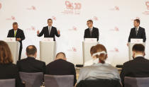 Prime ministers of Poland, Mateusz Morawiecki,second left, Hungary, Viktor Orban,left, Slovakia, Igor Matovic,right, and of The Czech Republic, Andrej Babis,second right, during a news conference following talks of their Visegrad Group of regional cooperation in Warsaw, Poland, on Friday, July 3, 2020. Poland, which took the group's 12-month rotating presidency, is seeking a generous EU budget to help the region recover from the coronavirus pandemic.(AP Photo/Czarek Sokolowski)