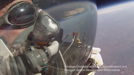 Google's vice president Alan Eustace looks out of his spacesuit into the stratosphere prior to a record-breaking skydive over New Mexico, in this still image taken from video October 24, 2014, a handout courtesy of the Paragon Space Development Corporation. REUTERS/Paragon Space Development Corporation/Handout via Reuters