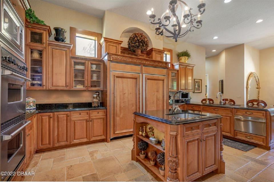 This stunning gourmet kitchen is well equipped with a built-in refrigerator and freezer, a unique wine cellar and extensive storage and a home-theater room.