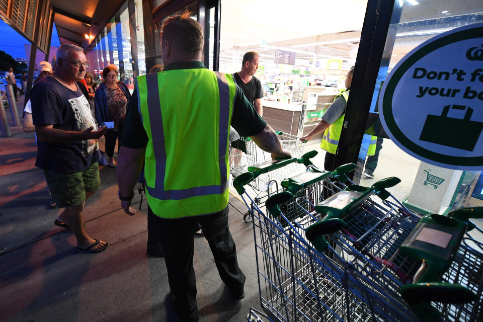 Shoppers enter a Woolworths supermarket in Melbourne. Source: AAP