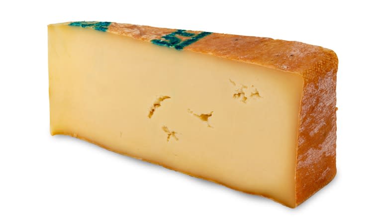 Wedge of cheese with rind