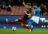 Soccer Football - Serie A - Napoli vs Genoa - Stadio San Paolo, Naples, Italy - March 18, 2018 Napoli's Elseid Hysaj in action with Genoa's Oscar Hiljemark REUTERS/Ciro De Luca