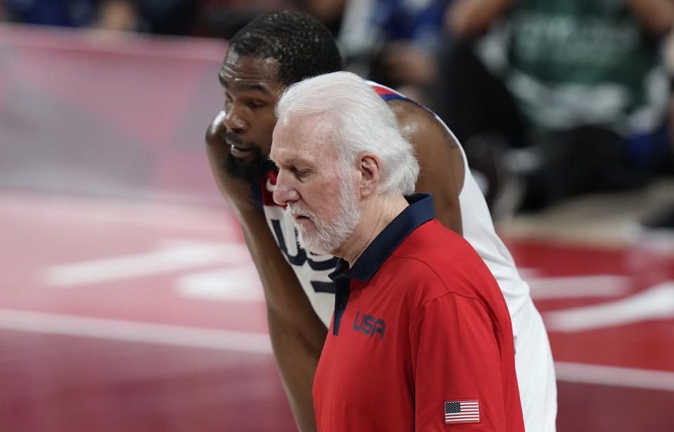 United States' Kevin Durant (7) listens to head coach Gregg Popovich during men's basketball gold medal game at the 2020 Summer Olympics, Saturday, Aug. 7, 2021, in Saitama, Japan. (AP Photo/Luca Bruno)