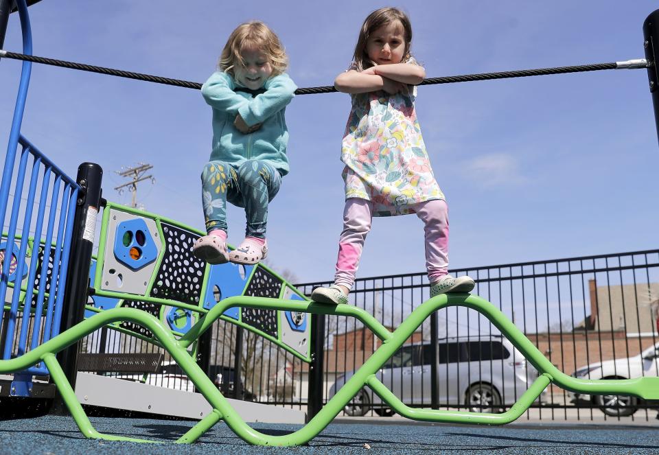 Ruby, left, and Raegan Nagel play at Emmanuel Inclusive Community Park, a new inclusive playground on the campus of Emmanuel Lutheran Church in Seymour. The playground is open to the public.