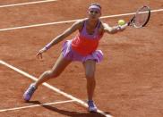 Lucie Safarova of the Czech Republic returns the ball to Maria Sharapova of Russia during their women's singles match during the French Open tennis tournament at the Roland Garros stadium in Paris, France, June 1, 2015. REUTERS/Jean-Paul Pelissier