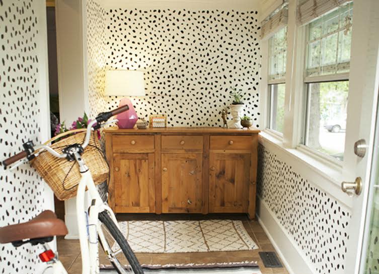 <body> <p>No more singing the blues after a coat or two of white paint. Once the canvas was dry, black spots <a rel="nofollow noopener" href=" http://www.bobvila.com/entranceway-design-ideas/48101-personalize-your-home-with-10-foolproof-stencil-projects/slideshows?bv=yahoo" target="_blank" data-ylk="slk:were stenciled;elm:context_link;itc:0;sec:content-canvas" class="link ">were stenciled</a> in a contrasting color, giving the space a lively and playful feel. If you look closely above the sideboard, you might just make out the fuse box that the pattern successfully camouflages. </p> <p><strong>Related: <a rel="nofollow noopener" href=" http://www.bobvila.com/how-to-paint-a-door/48398-9-things-you-can-do-with-1-gallon-of-paint/slideshows?bv=yahoo" target="_blank" data-ylk="slk:9 Things You Can Do With a Gallon of Paint;elm:context_link;itc:0;sec:content-canvas" class="link ">9 Things You Can Do With a Gallon of Paint</a> </strong> </p> </body>