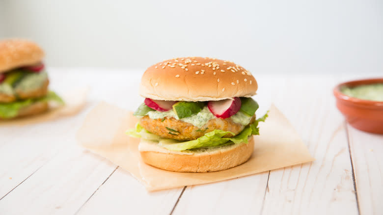 fish burger on white table