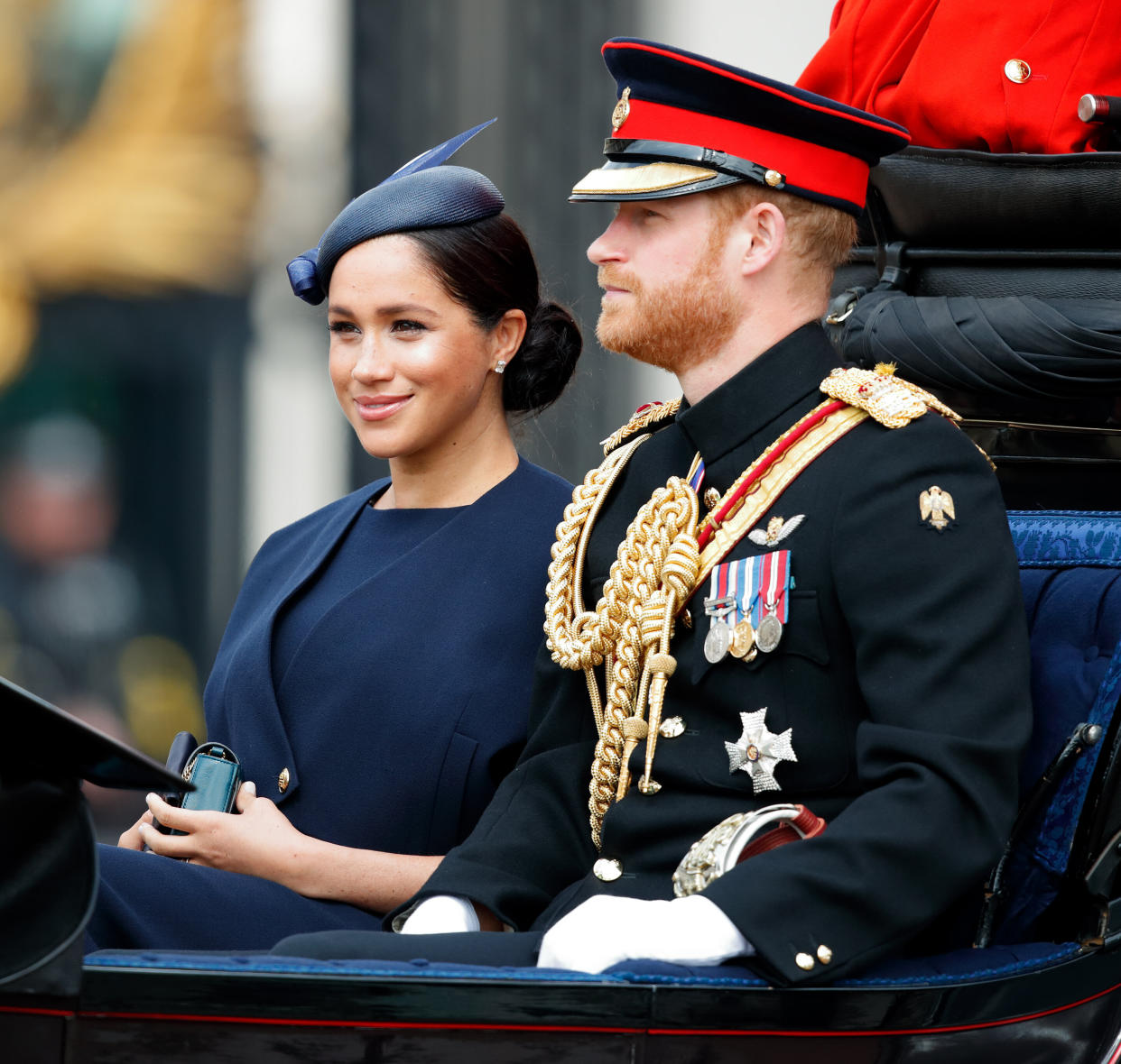 Meghan and Harry in a horse-drawn carriage during Trooping the Color, the Queen's annual birthday parade, in London.