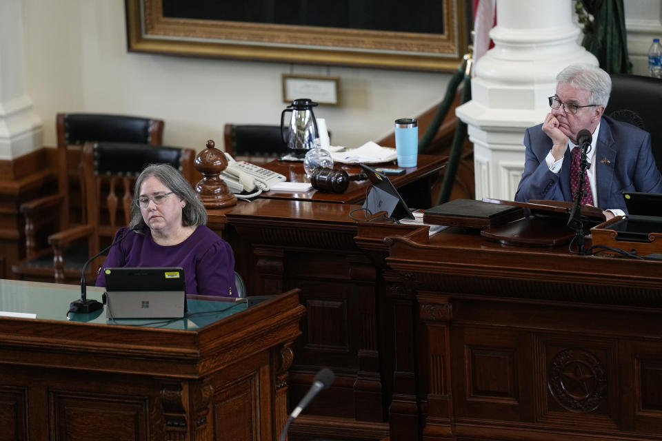 Texas Lt. Gov. Dan Patrickm, right, listens as witness Katherine "Missy" Minter Cary, former chief of staff in the Texas Attorney General's office testifies during day five of the impeachment trial for Texas Attorney General Ken Paxton in the Senate Chamber at the Texas Capitol, Monday, Sept. 11, 2023, in Austin, Texas. (AP Photo/Eric Gay)