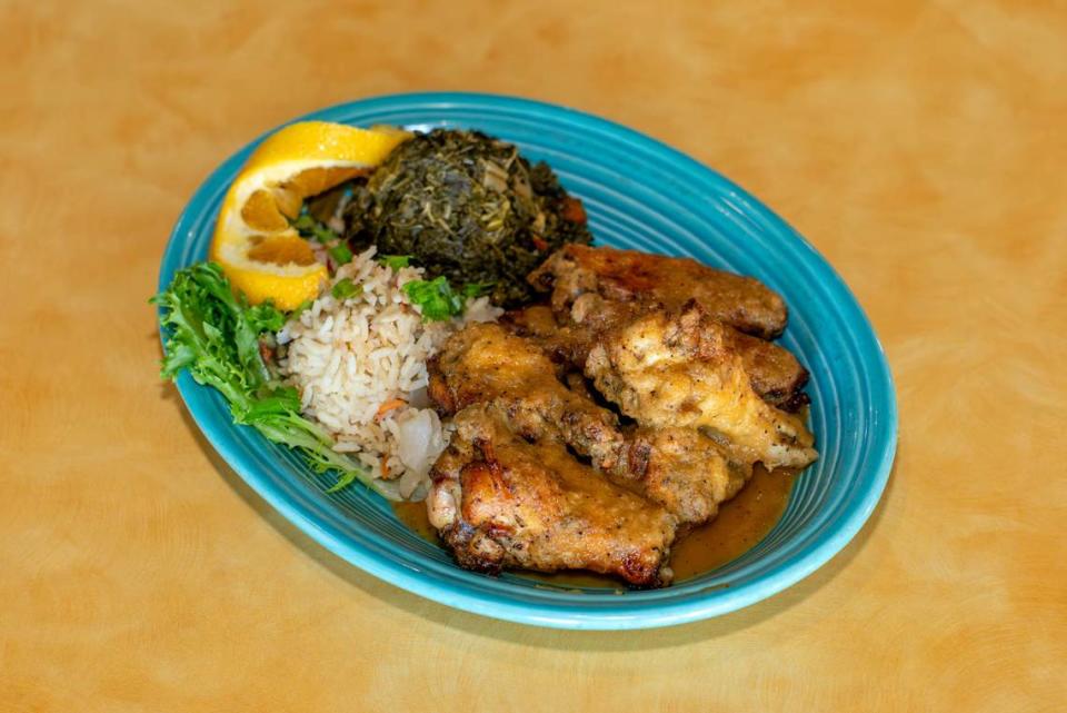 Anntony’s Caribbean Cafe Island Wings with Callaloo Greens and Calypso Rice.