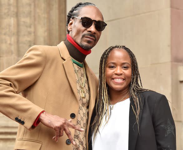 <p>Axelle/Bauer-Griffin/FilmMagic</p> Snoop Dog and Shante Broadus at Snoop's Hollywood Walk of Fame star ceremony in 2018.