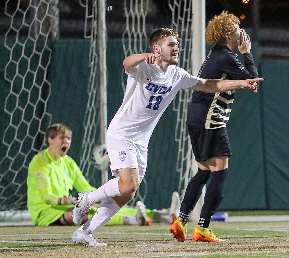 CVCA's Carson Reske celebrates the Royals game winning goal as St. Vincent-St. Mary keeper Nick Bertolini, left, and Courtney Dowe react on Thursday, Sept. 21, 2022 in Akron, Ohio. The Royals won the game 2-1.