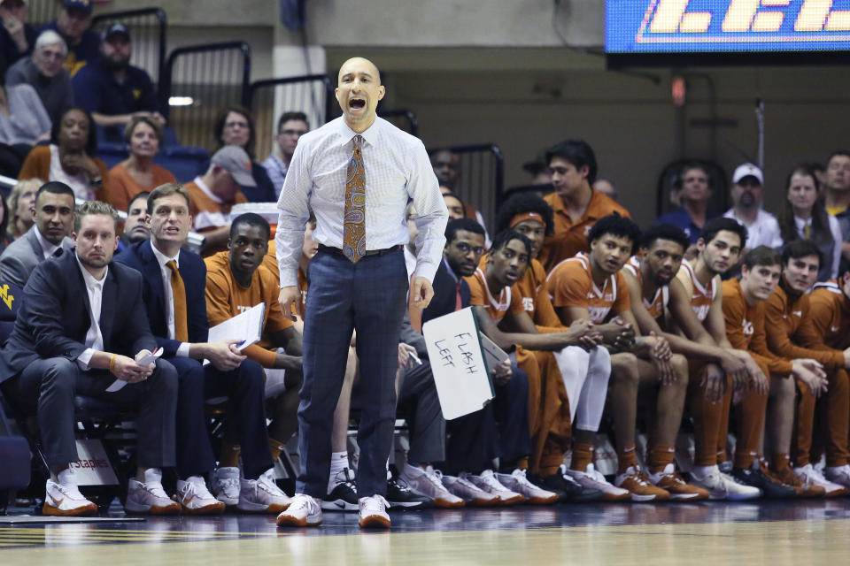 Texas coach Shaka Smart reacts during the first half of an NCAA college basketball game against West Virginia Monday, Jan. 20, 2020, in Morgantown, W.Va. (AP Photo/Kathleen Batten)