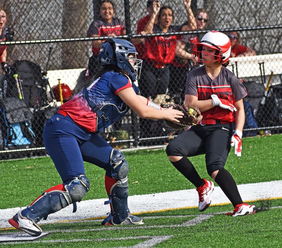 Rachele Chee of Honesdale is out at the plate during Lackawanna League softball action versus Riverside.