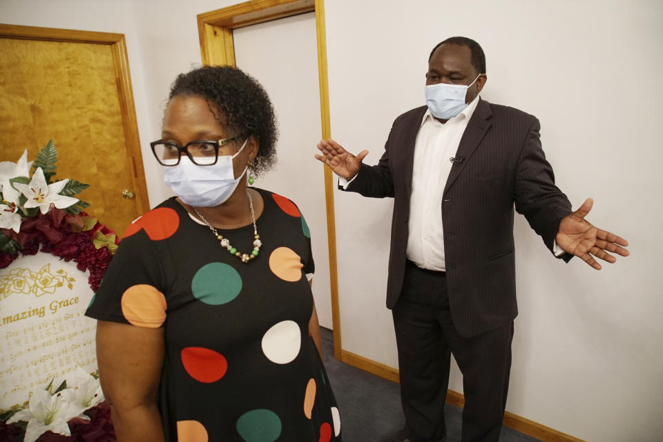 Shawn Troy consults with mourners on arrangements for a viewing at his family's funeral home in Mullins, S.C., on Sunday, May 23, 2021. The Troys had agreed that Shawn would take over the business during the next few years. But he had expected to do so with his father’s counsel. (AP Photo/Allen G. Breed)