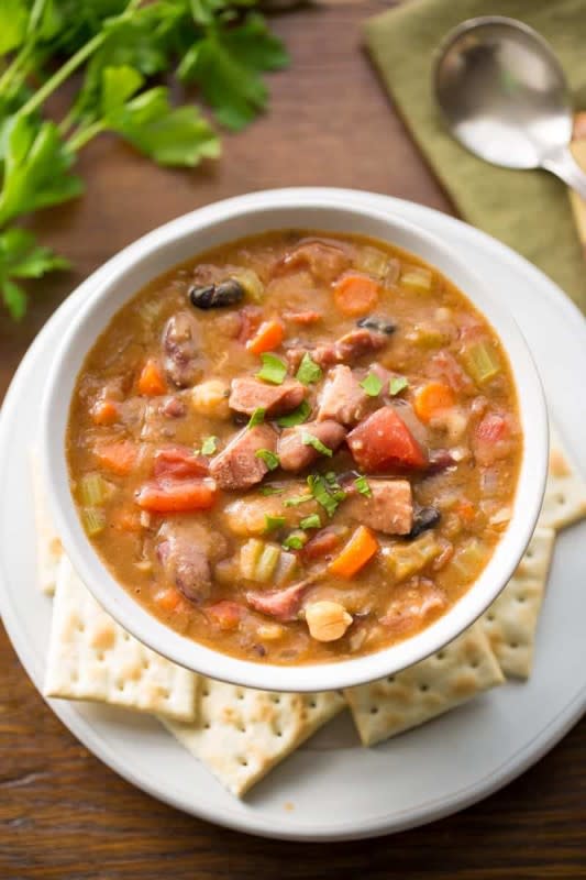 <p>Saving Room For Dessert</p><p>Save the ham bone too, then you can make this stick-to-your-ribs soup.</p><p><strong>Get the recipe: </strong><a href="https://www.savingdessert.com/15-bean-soup-ham-vegetables/" rel="nofollow noopener" target="_blank" data-ylk="slk:15 Bean Soup with Ham;elm:context_link;itc:0;sec:content-canvas" class="link "><strong>15 Bean Soup with Ham</strong></a></p>