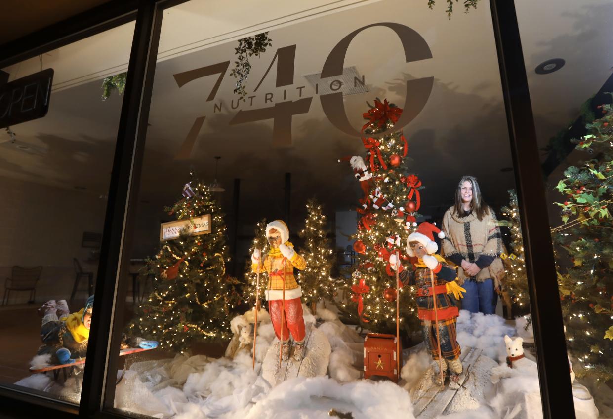 Angel Mac decorated the window at Nutrition 740 in downtown Zanesville for the city's 2022 Storybook Christmas celebration.
