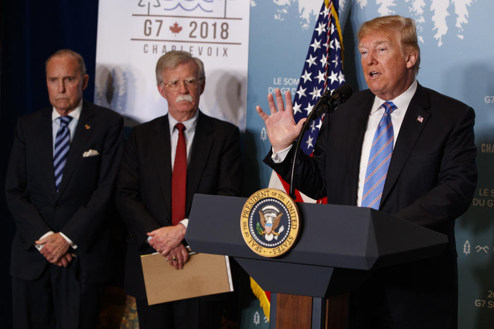 <p>White House chief economic adviser Larry Kudlow, left, and National Security Adviser John Bolton look on as President Donald Trump speaks during a news conference at the G-7 summit, Saturday, June 9, 2018, in La Malbaie, Quebec, Canada. (Photo: Evan Vucci/AP) </p>