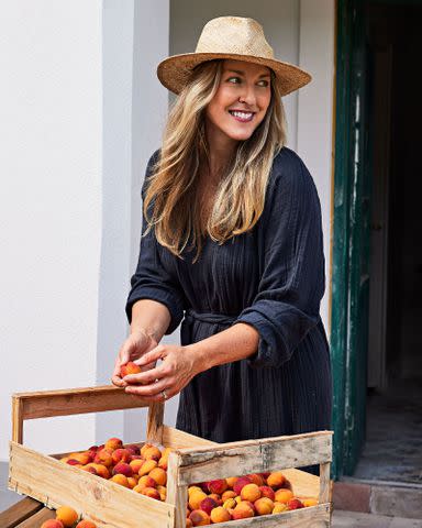 <p>Aubrie Pick</p> Sarah Copeland with her orchard haul.