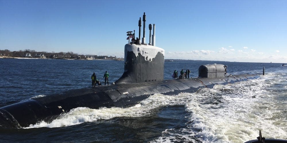 The Virginia-class, nuclear-powered, fast-attack submarine, USS North Dakota (SSN 784), transit the Thames River as they pull into their homeport on Naval Submarine Base New London in Groton, Conn.