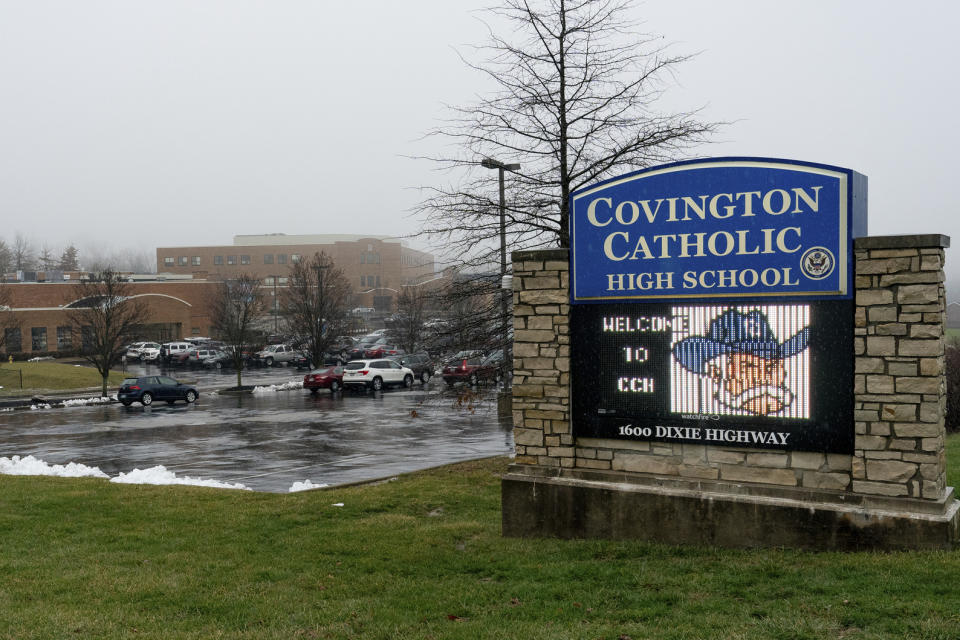 FILE - This Jan. 19, 2019 file photo shows an exterior view of Covington Catholic High School in Park Hills, Ky. Nicholas Sandmann, the Covington Catholic High School teen at the heart of an encounter last month with a Native American activist, is suing The Washington Post for $250 million. He is also threatening legal action against The Associated Press and other news organizations. In papers filed Tuesday in federal court in Kentucky, Nicholas Sandmann and his parents alleged that the Post had engaged in “targeting and bullying” and modern “McCarthyism.” (AP Photo/Bryan Woolston, File)