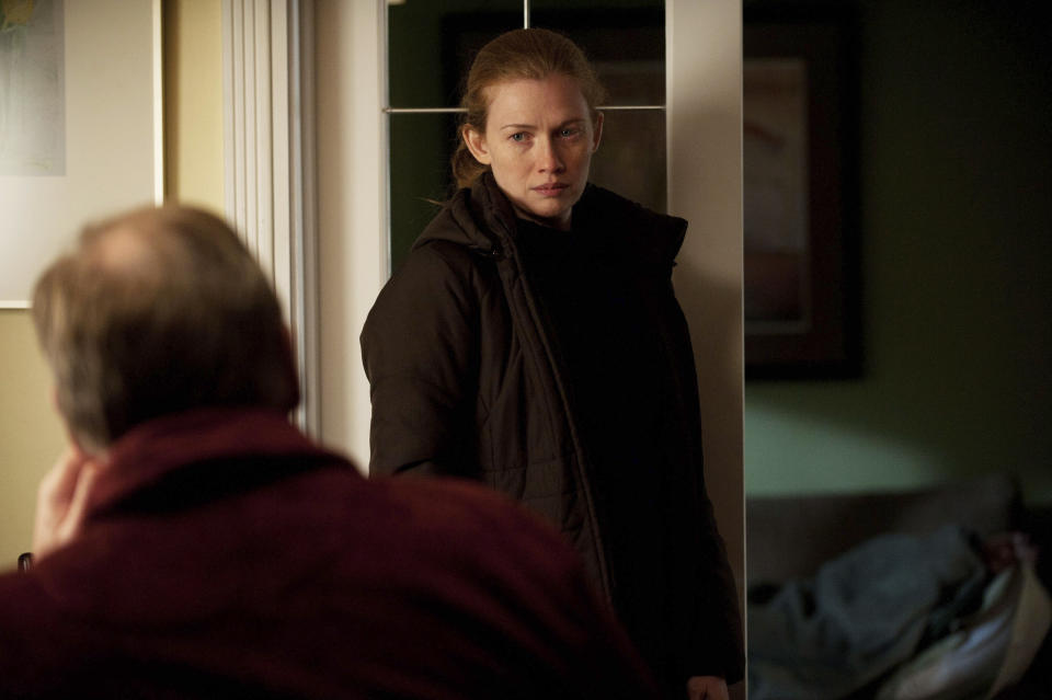 This image provided by AMC shows Mireille Enos, right, and Garry Chalk in a scene from season two of "The Killing." (AP Photo/AMC, Carole Segal)