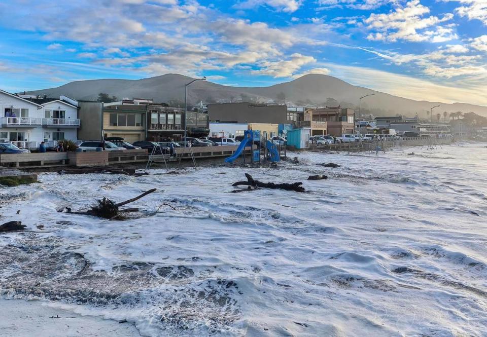 High surf sent waves all the way up the beach in Cayucos, flooding the playground and nearby streets on Thursday, Dec. 28, 2023.