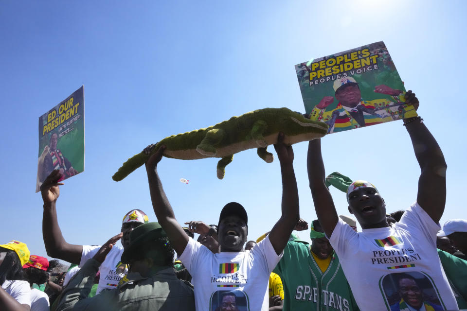 Supporters of Zimbabwean President Emmerson Mnangagwa attend a campaign rally in Harare, Aug. 9, 2023. 80-year-old Mnangagwa is now seeking re-election for a second term as president in a vote this week that could see the ruling ZANU-PF party extend a 43-year hold on power. (AP Photo/Tsvangirayi Mukwazhi)