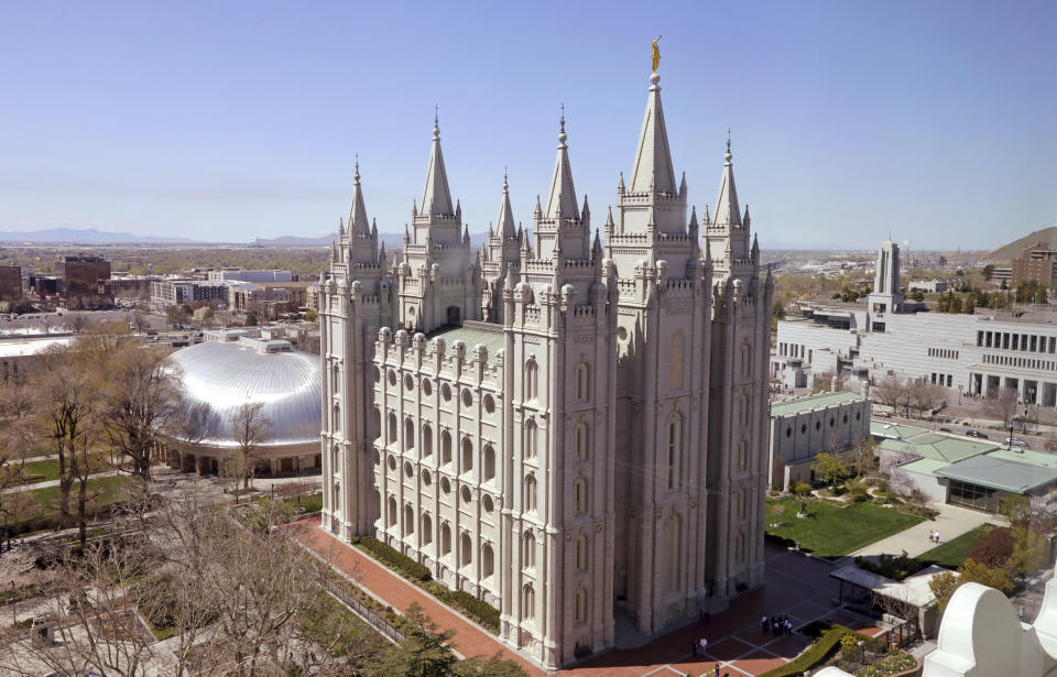 In this Thursday, April 18, 2019, photo, shows the Salt Lake Temple, in Salt Lake City. An iconic temple central to The Church of Jesus Christ of Latter-day Saints faith will close for four years to complete a major renovation, and officials are keeping a careful eye on construction plans after a devastating fire at Notre Dame cathedral in Paris. (AP Photo/Rick Bowmer)