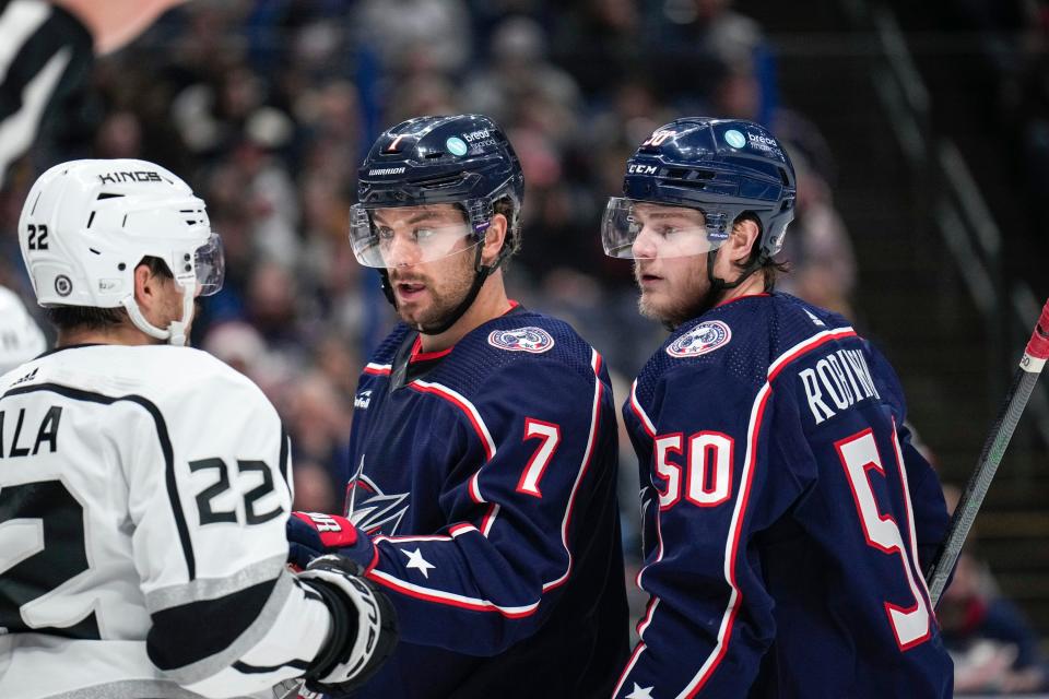 Dec 11, 2022; Columbus, Ohio, United States;  Columbus Blue Jackets center Sean Kuraly (7) pushes Los Angeles Kings left wing Kevin Fiala (22) back while left wing Eric Robinson (50) watches during the second period of the NHL hockey game between the Columbus Blue Jackets and the Los Angeles Kings at Nationwide Arena. Mandatory Credit: Joseph Scheller-The Columbus Dispatch