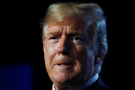 U.S. President Donald Trump reacts as he holds a news conference after participating in the NATO Summit in Brussels, Belgium July 12, 2018. REUTERS/Kevin Lamarque