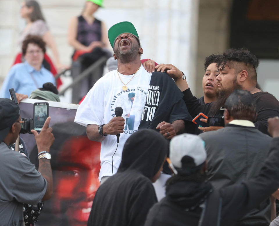 <p>John Thompson, center, a friend and former co-worker of Philando Castile, talks Friday, June 16, 2017, outside the state Capitol in St. Paul, Minn., about the loss of his friend and the police officer who was cleared Friday in Castile’s fatal shooting last year. (David Joles/Star Tribune via AP) </p>