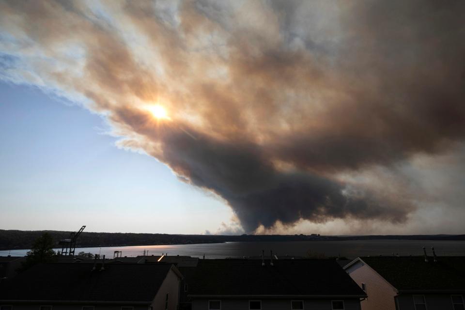 Thick plumes of heavy smoke fill the Halifax sky as an out-of-control fire in a suburban community quickly spread, engulfing multiple homes and forcing the evacuation of local residents, in Halifax, Nova Scotia, on Sunday May 28, 2023.