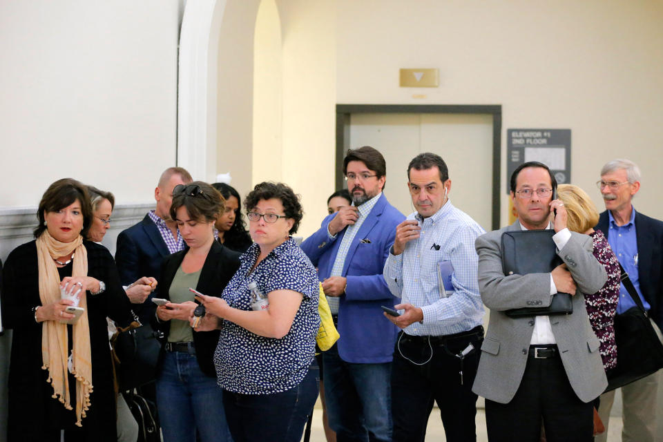 <p>Journalists wait to re enter the courtroom after being called back in during the fifth day of deliberations in Bill Cosby’s sexual assault trial at the Montgomery County Courthouse on June 16, 2017 in Norristown, Pa. (Photo: Lucas Jackson-Pool/Getty Images) </p>