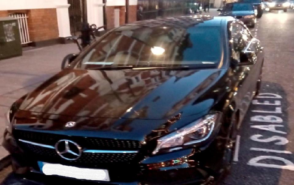 Alexandra Miller's black Mercedes in a disabled parking spot in Basil Street in Knightsbridge