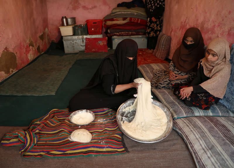 Delkhah Sultani, 30, an Afghan widow who lost her husband in a suicide attack almost six years ago, prepares bread, amid concerns about coronavirus disease (COVID-19), in Kabul