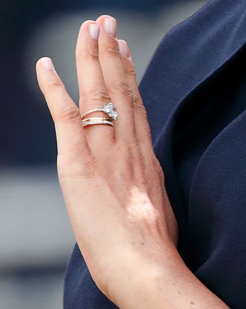 <p>The royal made her first public appearance after the birth of her son at the 2019 Trooping of the Colour ceremony, and fans were quick to notice something different about Markle's left finger. The Duchess of Sussex debuted a <a href="https://www.townandcountrymag.com/style/jewelry-and-watches/a28157762/meghan-markle-redesigned-engagement-ring-photos/" rel="nofollow noopener" target="_blank" data-ylk="slk:revamped engagement ring;elm:context_link;itc:0;sec:content-canvas" class="link ">revamped engagement ring</a>—replacing the original gold band with a thinner band of pavé diamonds—as well as a new diamond eternity band on her stack. </p>