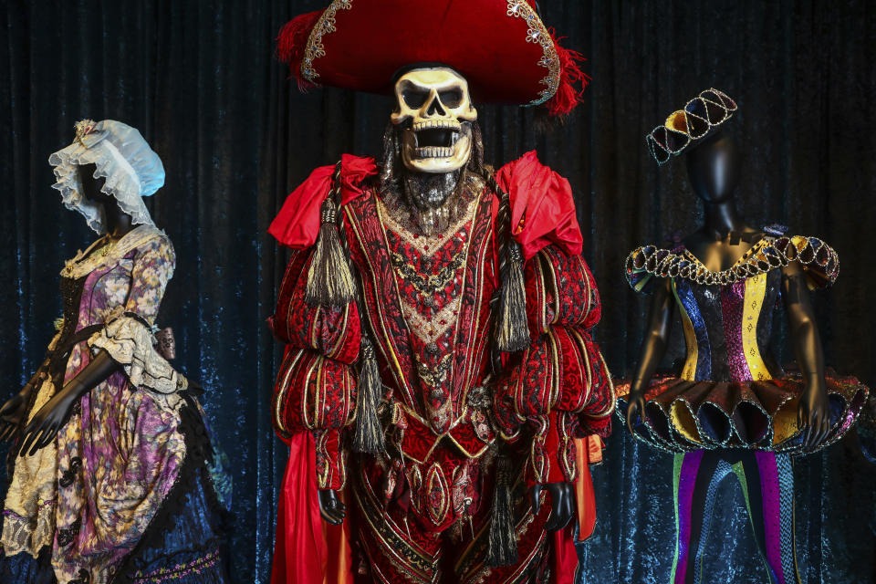 FILE - Costumes from the Broadway musical "The Phantom of the Opera," are displayed at the "Showstoppers! Spectacular Costumes from Stage & Screen" exhibit, benefitting the Costume Industry Coalition Recovery Fund, in Times Square on Monday, Aug. 2, 2021, in New York. "The Phantom of the Opera," Broadway's longest-running show, will play its final performance on Broadway on Feb. 18, 2023, a spokesperson told The Associated Press on Friday, Sept. 16, 2022. The closing will come less than a month after its 35th anniversary. (Photo by Andy Kropa/Invision/AP, File)