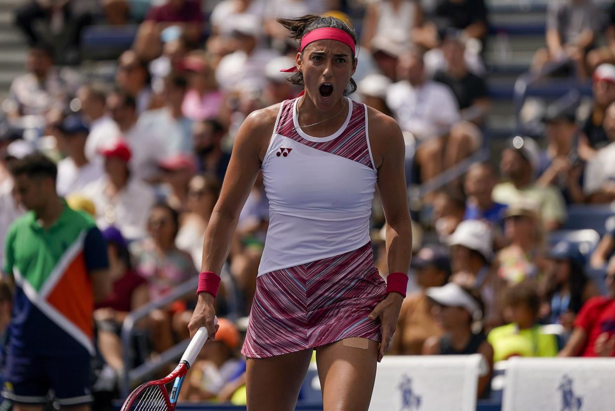 Caroline Garcia, of France, reacts against Kamilla Rakhimova, of Russia, during the first round of the U.S. Open tennis championships, Monday, Aug. 29, 2022, in New York.