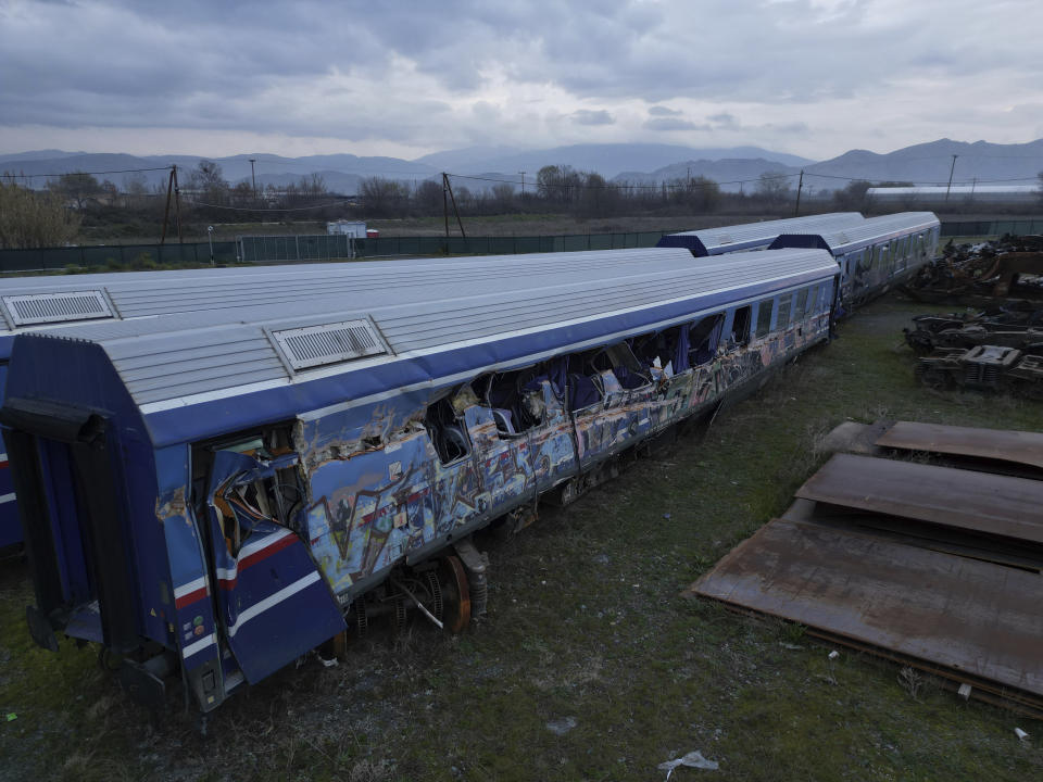 An aerial view of the wagons and other parts recovered from a train wreck, near Larissa city, central Greece, Wednesday, Feb. 28, 2024. Greece's deadliest rail disaster killed 57 people when a passenger train slammed into an oncoming cargo train. The tragedy shocked the country, with many of the victims being university students. (AP Photo)