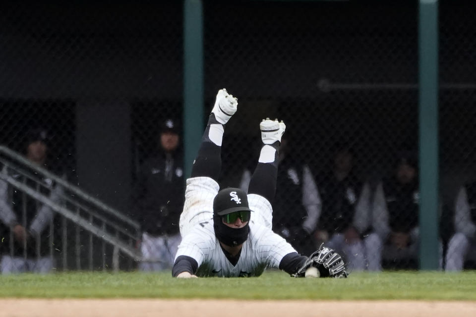 Chicago White Sox's Andrew Vaughn is unable to make a diving catch of Kansas City Royals' Andrew Benintendi's RBI single during the sixth inning of a baseball game Wednesday, April 27, 2022, in Chicago. (AP Photo/Charles Rex Arbogast)