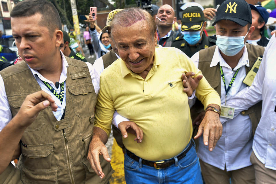 Rodolfo Hernandez, presidential candidate with the Anti-corruption Governors League, leaves a polling station after voting in presidential elections in Bucaramanga, Colombia, Sunday, May 29, 2022. (AP Photo/Mauricio Pinzon)
