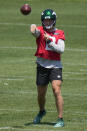 New York Jets quarterback Zach Wilson participates in a drill at the NFL football team's training facility in Florham Park, N.J., Wednesday, May 31, 2023. (AP Photo/Seth Wenig)