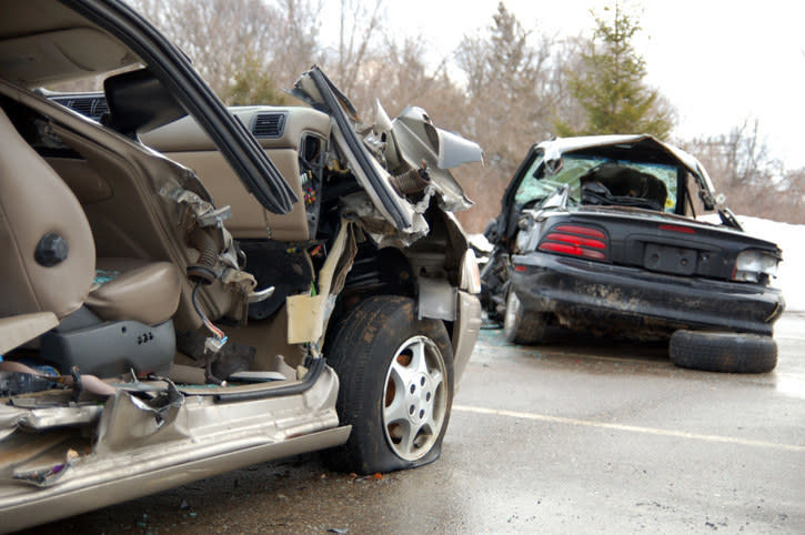 Accident scene showing passenger-side seat and door demolished