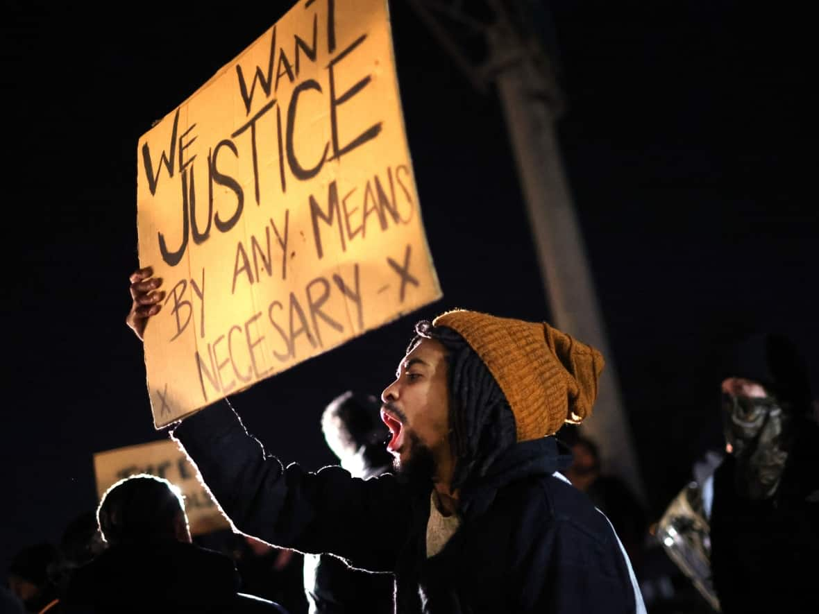 Demonstrators, protest the death of Tyre Nichols in Memphis, Tenn. Five Black Memphis Police officers have been fired after an internal investigation found them to be 'directly responsible' for the beating and have been charged with multiple crimes. (Scott Olson/Getty Images - image credit)